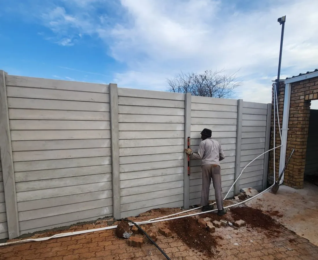 A Midwest installer levelling a new precast wall