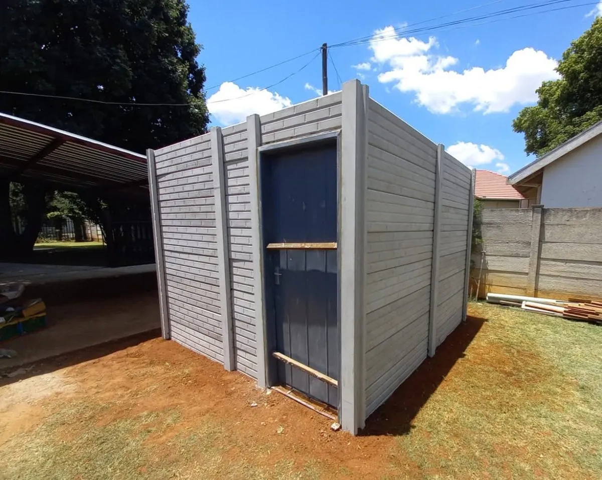 A Midwest precast shed with a door, built on a lawn